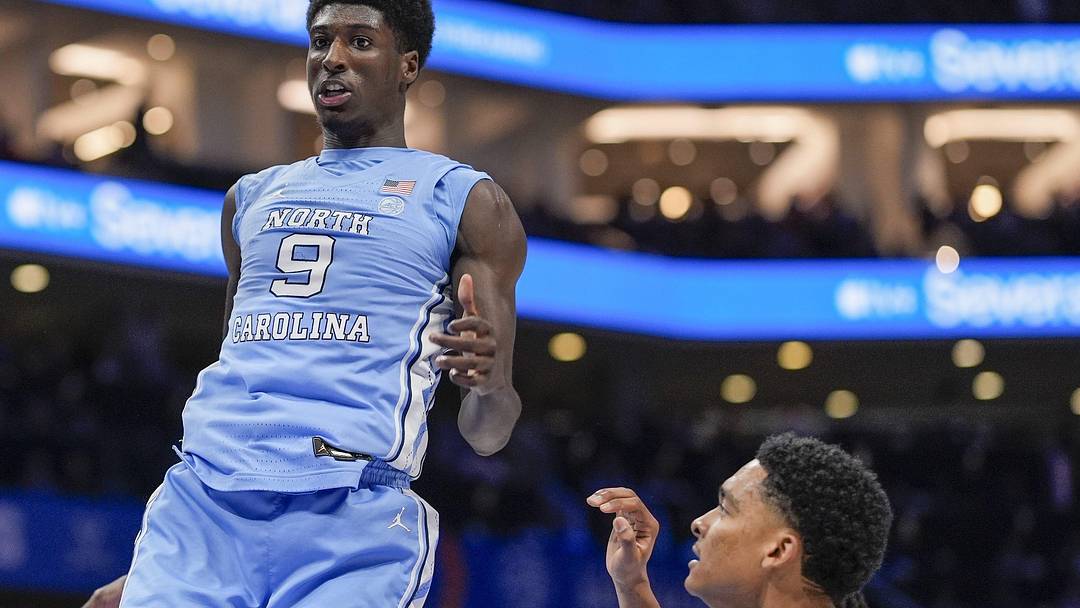 Mar 14, 2025; Charlotte, NC, USA; North Carolina Tar Heels guard Drake Powell (9) with a dunk against the Duke Blue Devils during the first half at Spectrum Center. Mandatory Credit: Jim Dedmon-Imagn Images Mar 14, 2025; Charlotte, NC, USA; North Carolina Tar Heels guard Drake Powell (9) with a dunk against the Duke Blue Devils during the first half at Spectrum Center. Mandatory Credit: Jim Dedmon-Imagn Images