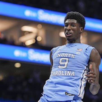 Mar 14, 2025; Charlotte, NC, USA; North Carolina Tar Heels guard Drake Powell (9) with a dunk against the Duke Blue Devils during the first half at Spectrum Center. Mandatory Credit: Jim Dedmon-Imagn Images