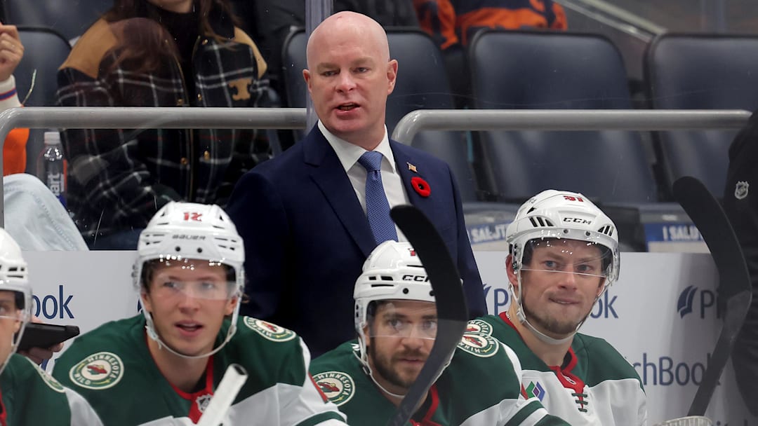 Nov 7, 2025; Elmont, New York, USA; Minnesota Wild head coach John Hynes coaches against the New York Islanders during the first period at UBS Arena. Mandatory Credit: Brad Penner-Imagn Images
