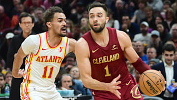 Cavaliers guard Max Strus (1) drives against Hawks guard Trae Young (11) during the second half in Cleveland. 