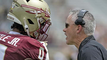 Sep 6, 2025; Tallahassee, Florida, USA; Florida State Seminoles head coach Mike Norvell speaks to safety Earl Little Jr. (0) during the second half against the East Texas A&M Lions at Doak S. Campbell Stadium. Mandatory Credit: Melina Myers-Imagn Images