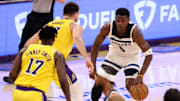 Minnesota Timberwolves guard Anthony Edwards dribbles the ball against Los Angeles Lakers guard Luka Doncic during the first quarter of Game 2 of their first-round playoff series at Crypto.com Arena in Los Angeles on April 22, 2025. 
