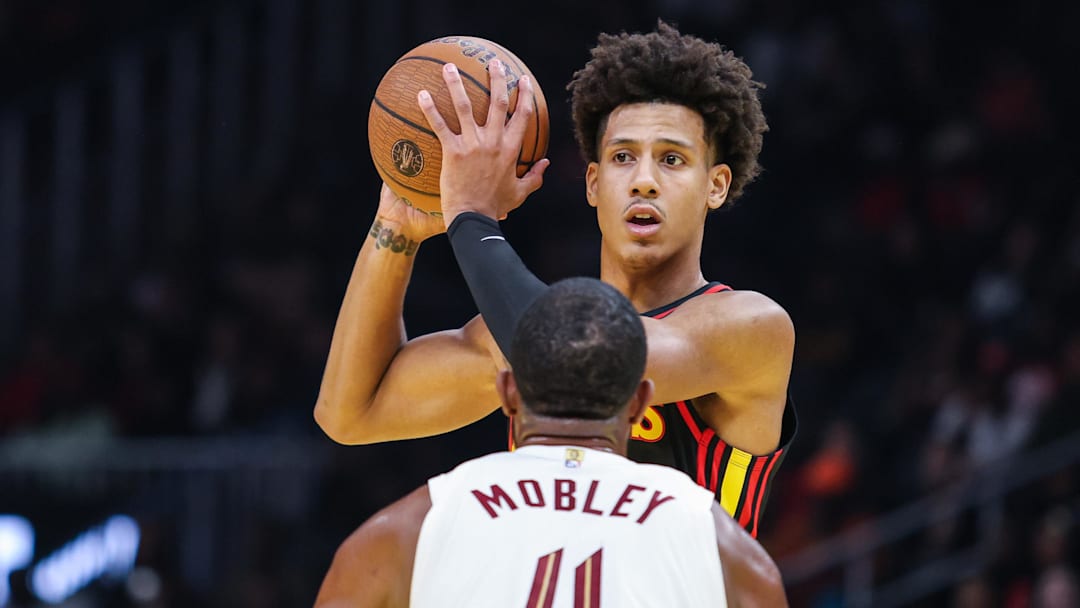 Atlanta Hawks wing Jalen Johnson looks for the pass against Cleveland Cavaliers center Evan Mobley.