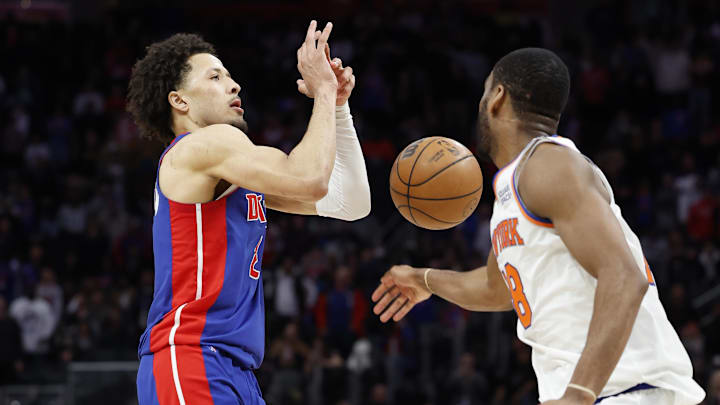 Mar 27, 2022; Detroit, Michigan, USA;  New York Knicks guard Alec Burks (18) steals the ball from Detroit Pistons guard Cade Cunningham (2) : Rick Osentoski-Imagn Images