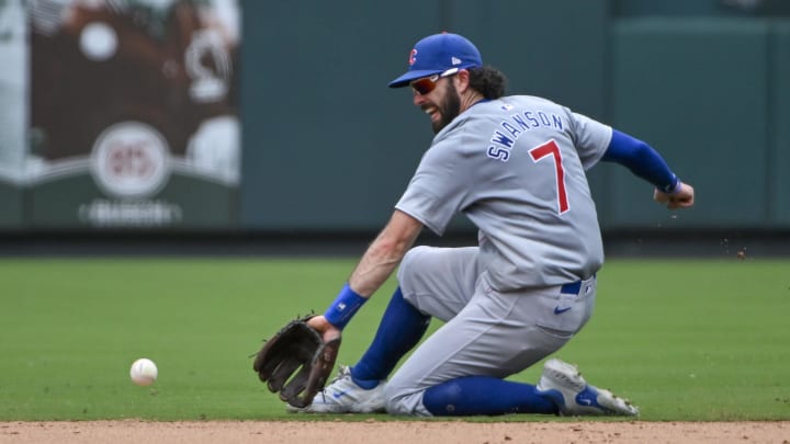 Jul 14, 2024; St. Louis, Missouri, USA;  Chicago Cubs shortstop Dansby Swanson (7) fields a ground ball against the St. Louis Cardinals during the seventh inning at Busch Stadium.