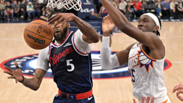Oct 24, 2025; Inglewood, California, USA; Los Angeles Clippers forward John Collins (20) and Phoenix Suns center Mark Williams (15) reach for a rebound in the second half at Intuit Dome. Mandatory Credit: Jayne Kamin-Oncea-Imagn Images