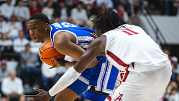 Feb 22, 2025; Tuscaloosa, Alabama, USA; Kentucky Wildcats forward Brandon Garrison (10) works against Alabama Crimson Tide center Clifford Omoruyi (11) during the second half at Coleman Coliseum. Mandatory Credit: Will McLelland-Imagn Images