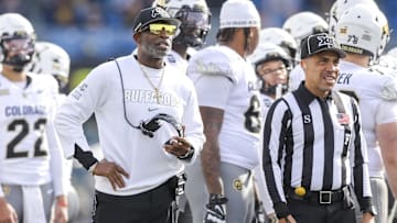 Nov 8, 2025; Morgantown, West Virginia, USA; Colorado Buffaloes head coach Deion Sanders watches the big screen during a replay during the first quarter against the West Virginia Mountaineers at Milan Puskar Stadium. Mandatory Credit: Ben Queen-Imagn Images