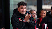 Nebraska quarterback Dylan Raiola greets his teammates before the Iowa game.