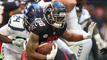 Oct 20, 2024; Atlanta, Georgia, USA; Atlanta Falcons running back Jase McClellan (30) runs the ball against the Seattle Seahawks in the fourth quarter at Mercedes-Benz Stadium. Mandatory Credit: Brett Davis-Imagn Images
