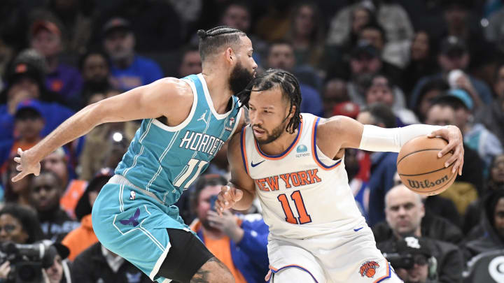 Jan 29, 2024; Charlotte, North Carolina, USA;  New York Knicks guard Jalen Brunson (11) moves into Charlotte Hornets forward Cody Martin (11) during the second half at the Spectrum Center. Mandatory Credit: Sam Sharpe-USA TODAY Sports