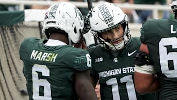 Oct 11, 2025; East Lansing, Michigan, USA; Michigan State wide receiver Nick Marsh (6) celebrates a touchdown against the UCLA Bruins with quarterback Alessio Milivojevic (11) in the fourth quarter at Spartan Stadium. Mandatory Credit: Brendan Mullin-Imagn Images