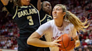 Indiana's Karoline Striplin (11) looks to score around Oakland's Dani Grim (3) during the Indiana versus Oakland women's basketball game at Simon Skjodt Assembly Hall on Sunday, Dec. 22, 2024.