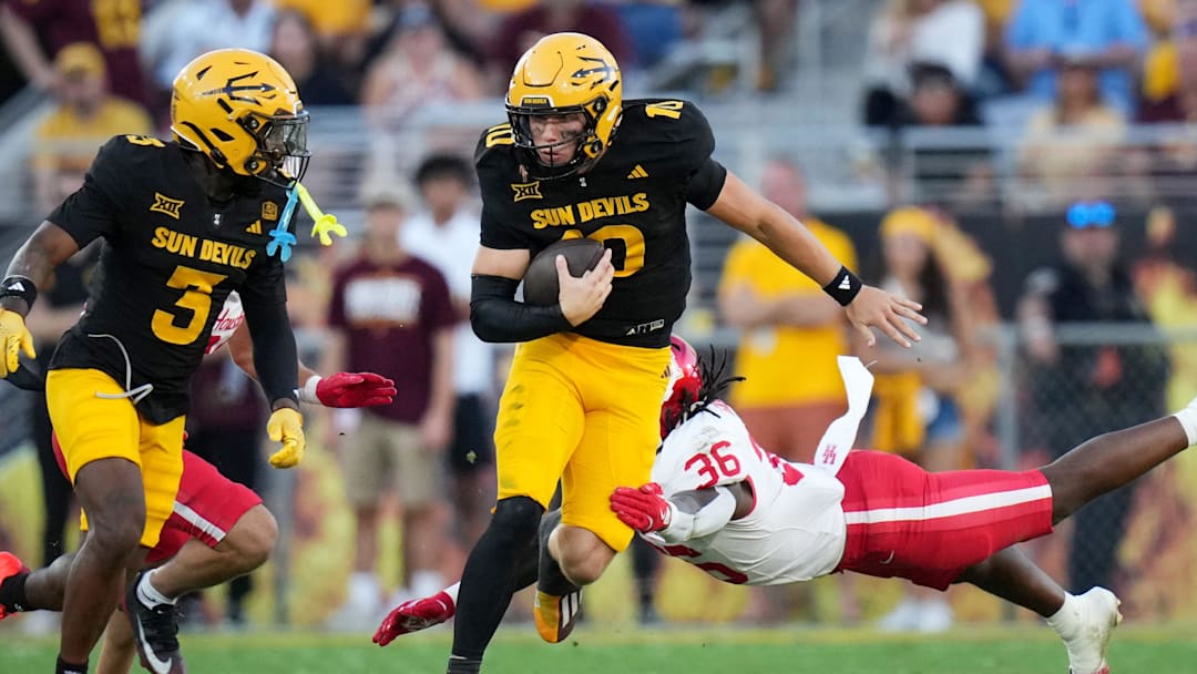ASU Sun Devils quarterback Sam Leavitt (10) scrambles out of the backfield against the Houston Cougars at Mountain America Stadium in Tempe.