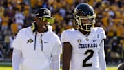 Oct 7, 2023; Tempe, Arizona, USA; Colorado Buffaloes head coach Deion Sanders with son and quarterback Shedeur Sanders (2) against the Arizona State Sun Devils at Mountain America Stadium. 