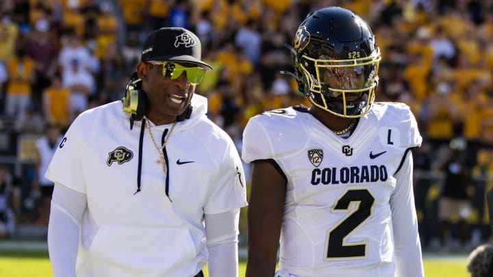 Oct 7, 2023; Tempe, Arizona, USA; Colorado Buffaloes head coach Deion Sanders with son and quarterback Shedeur Sanders (2) against the Arizona State Sun Devils at Mountain America Stadium. Mandatory Credit: Mark J. Rebilas-USA TODAY Sports