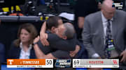 Houston head coach Kelvin Sampson and assistant Kellen Sampson embrace after win over Tennessee in Elite Eight.