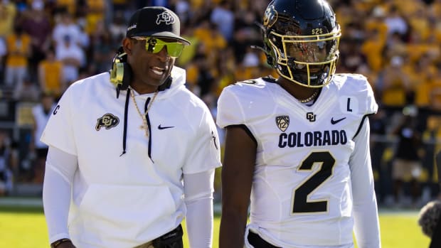 Oct 7, 2023; Tempe, Arizona, USA; Colorado Buffaloes head coach Deion Sanders with son and quarterback Shedeur Sanders (2) 