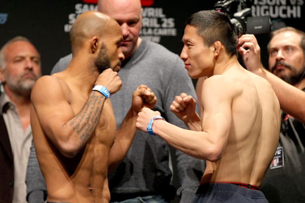 Demetrious Johnson and Kyoji Horiguchi pose during weigh-ins for UFC 186 at Metropolis. 