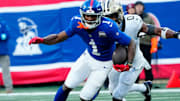 New York Giants wide receiver Malik Nabers (1) runs with the ball, as New Orleans Saints safety Ugo Amadi (0) tries to catch him, Sunday, December 8, 2024.