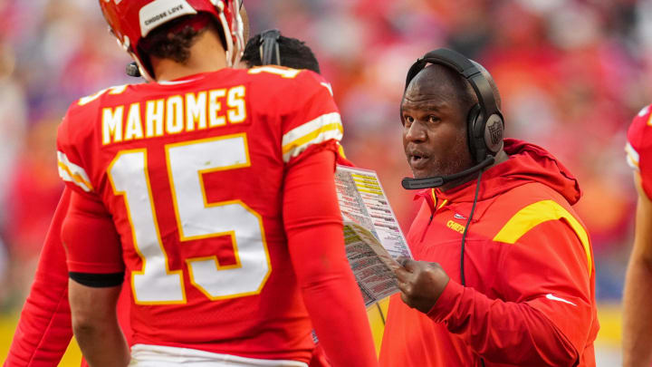 Oct 16, 2022; Kansas City, Missouri, USA; Kansas City Chiefs offensive coordinator Eric Bieniemy talks with quarterback Patrick Mahomes (15) during the second half against the Buffalo Bills at GEHA Field at Arrowhead Stadium. Mandatory Credit: Jay Biggerstaff-USA TODAY Sports