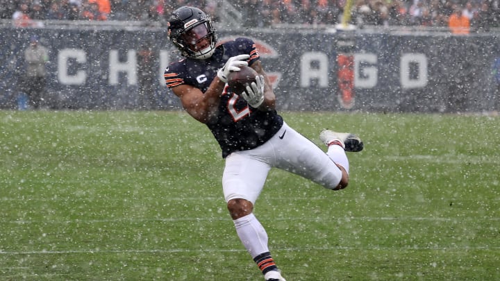 Dec 31, 2023; Chicago, Illinois, USA; Chicago Bears wide receiver DJ Moore (2) makes a catch over