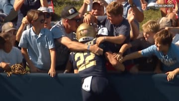 Navy receiver Eli Heidenreich celebrated with his family after one of his three touchdowns Saturday