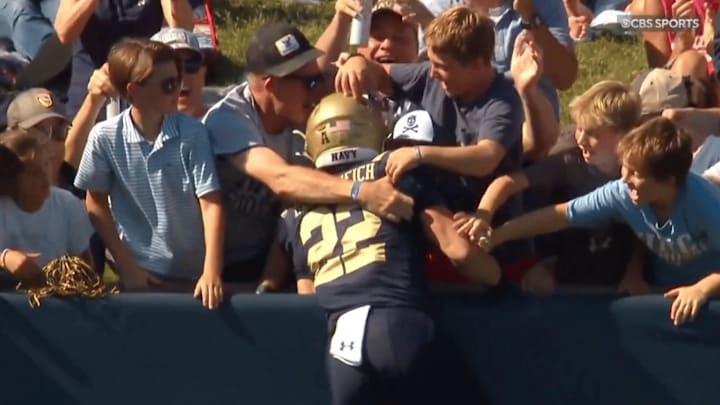 Navy receiver Eli Heidenreich celebrated with his family after one of his three touchdowns Saturday Navy receiver Eli Heidenreich celebrated with his family after one of his three touchdowns Saturday