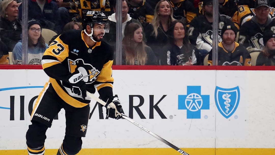 Dec 23, 2024; Pittsburgh, Pennsylvania, USA;  Pittsburgh Penguins defenseman Pierre-Olivier Joseph (73) handles the puck against the Philadelphia Flyers during the first period at PPG Paints Arena. Mandatory Credit: Charles LeClaire-Imagn Images