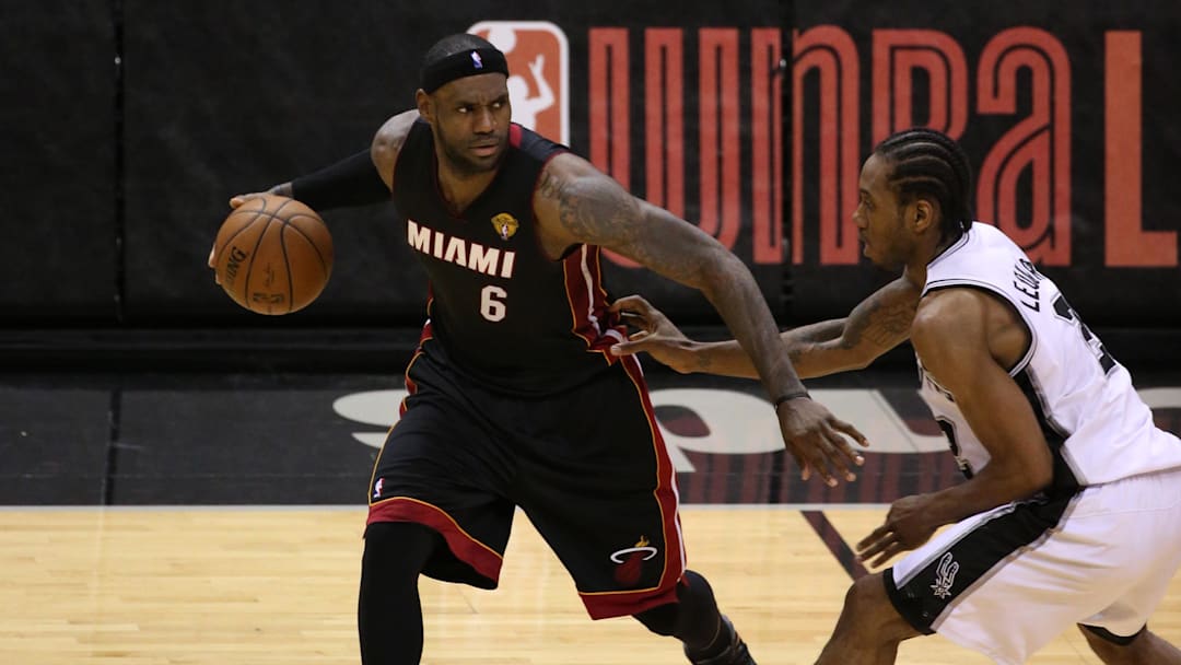 Jun 15, 2014; San Antonio, TX, USA; Miami Heat forward LeBron James (6) shoots against San Antonio Spurs forward Kawhi Leonard (2) in game five of the 2014 NBA Finals at AT&T Center. Mandatory Credit: Soobum Im-Imagn Images
