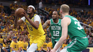 May 25, 2024; Indianapolis, Indiana, USA; Indiana Pacers center Myles Turner (33) dunks against Boston Celtics forward Oshae Brissett (12) and forward Sam Hauser (30) during the second quarter of game three of the eastern conference finals in the 2024 NBA playoffs at Gainbridge Fieldhouse. Mandatory Credit: Trevor Ruszkowski-USA TODAY Sports
