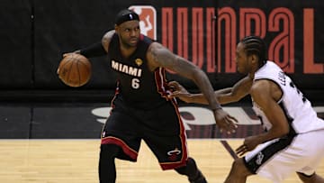 Jun 15, 2014; San Antonio, TX, USA; Miami Heat forward LeBron James (6) shoots against San Antonio Spurs forward Kawhi Leonard (2) in game five of the 2014 NBA Finals at AT&T Center. Mandatory Credit: Soobum Im-Imagn Images