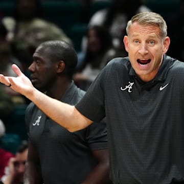 Nov 27, 2024; Las Vegas, Nevada, USA; Alabama Crimson Tide head coach Nate Oats protests a call in favor of the Rutgers Scarlet Knights during the first half at MGM Grand Garden Arena. Mandatory Credit: Stephen R. Sylvanie-Imagn Images