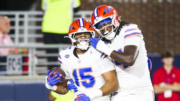 Nov 15, 2025; Oxford, Mississippi, USA; Florida Gators defensive lineman Jayden Woods (15) celebrates with defensive end Kamran James (24) following an interception against the Mississippi Rebels during the first quarter at Vaught-Hemingway Stadium. Mandatory Credit: Petre Thomas-Imagn Images
