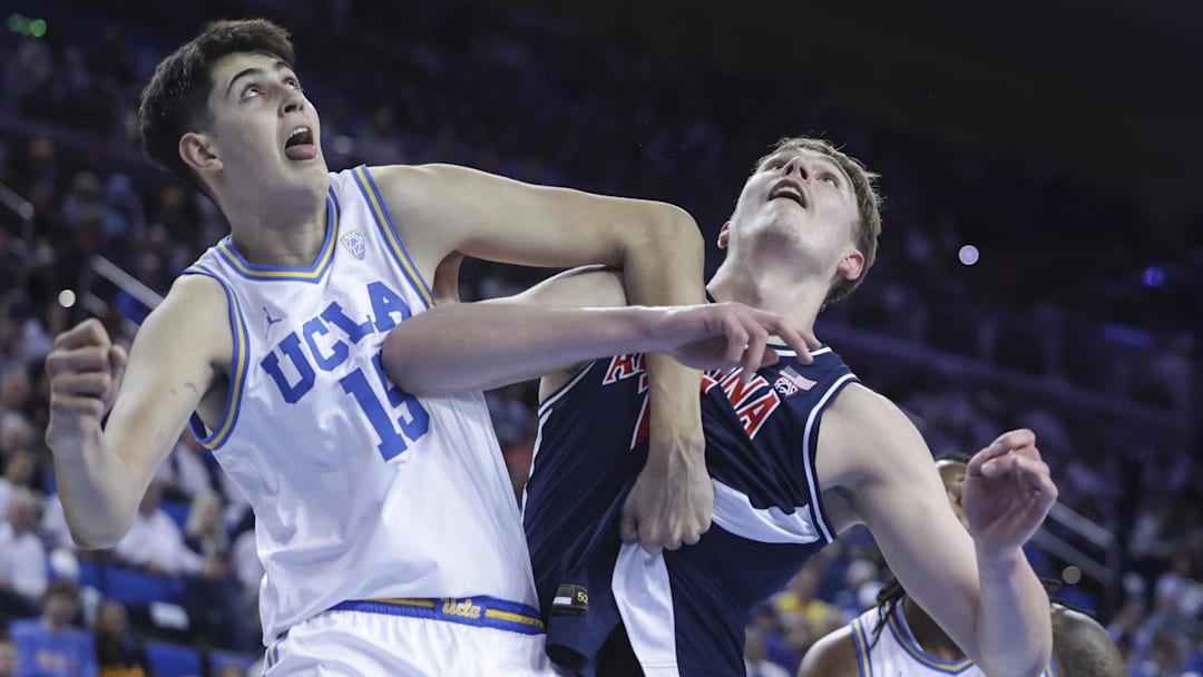 Mar 7, 2024; Los Angeles, California, USA; UCLA center Aday Mara (15) and Arizona Wildcats center Motiejus Krivas (14) fight for the ball during the first half of a game at Pauley Pavilion presented by Wescom.