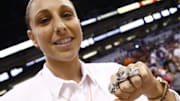 Phoenix Mercury star Diana Taurasi shows off her three WNBA Championship rings during ceremonies at the season opener on June 5, 2015, at US Airways Center in Phoenix.