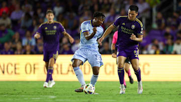 Oct 19, 2024; Orlando, Florida, USA; Atlanta United midfielder Ajani Fortune (35) controls the ball from Orlando City midfielder Cesar Araujo (5) in the second half at Inter&Co Stadium. Mandatory Credit: Nathan Ray Seebeck-Imagn Images