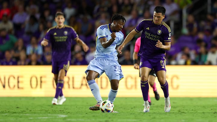 Oct 19, 2024; Orlando, Florida, USA; Atlanta United midfielder Ajani Fortune (35) controls the ball from Orlando City midfielder Cesar Araujo (5) in the second half at Inter&Co Stadium. Mandatory Credit: Nathan Ray Seebeck-Imagn Images