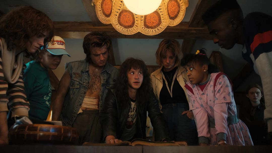 STRANGER THINGS. (L to R) Natalia Dyer as Nancy Wheeler, Gaten Matarazzo as Dustin Henderson, Joe Keery as Steve Harrington, Joseph Quinn as Eddie Munson, Maya Hawke as Robin Buckley, Priah Ferguson as Erica Sinclair, Sadie Sink as Max Mayfield, and Caleb McLaughlin as Lucas Sinclair in STRANGER THINGS. Cr. Courtesy of Netflix © 2022 STRANGER THINGS. (L to R) Natalia Dyer as Nancy Wheeler, Gaten Matarazzo as Dustin Henderson, Joe Keery as Steve Harrington, Joseph Quinn as Eddie Munson, Maya Hawke as Robin Buckley, Priah Ferguson as Erica Sinclair, Sadie Sink as Max Mayfield, and Caleb McLaughlin as Lucas Sinclair in STRANGER THINGS. Cr. Courtesy of Netflix © 2022