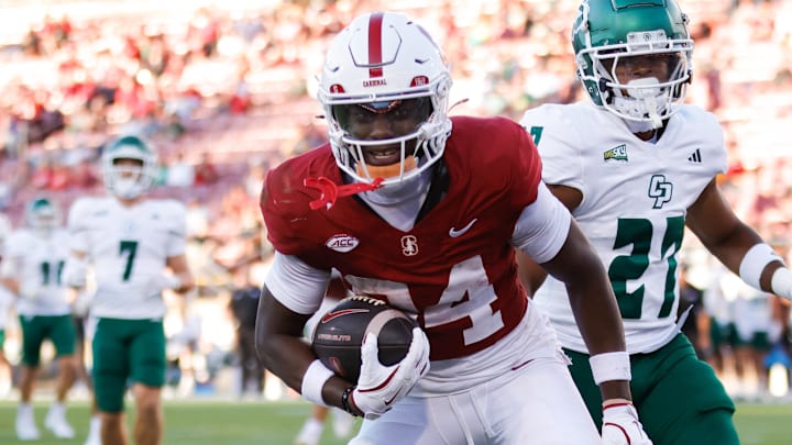 Stanford Cardinal wide receiver Ismael Cisse (84) scores a touchdown against the Cal Poly Mustangs during the second half at Stanford Stadium.