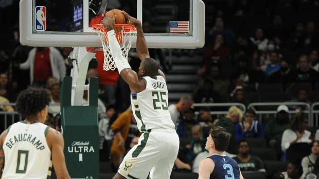 Oct 1, 2022; Milwaukee, Wisconsin, USA;  Milwaukee Bucks center Serge Ibaka (25) dunks the ball against the Memphis Grizzlies in the first half at Fiserv Forum. Mandatory Credit: Michael McLoone-USA TODAY Sports