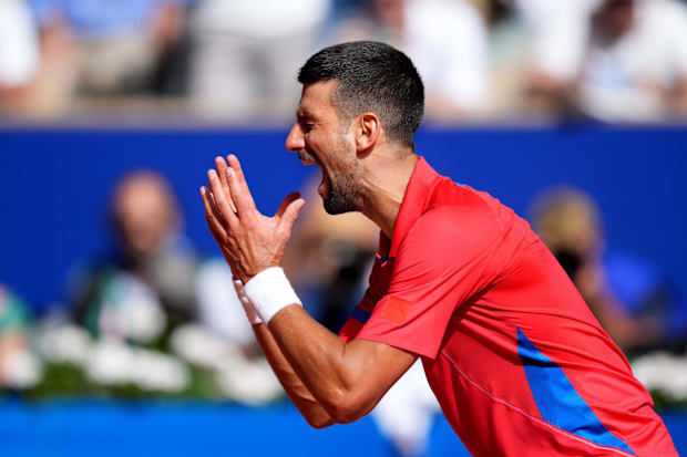 Novak Djokovic reacts after win the Olympic gold medal