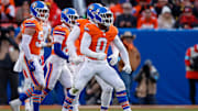 Jan 5, 2025; Denver, Colorado, USA; Denver Broncos linebacker Jonathon Cooper (0) reacts ahead of teammates after a sack in the second quarter against the Kansas City Chiefs at Empower Field at Mile High. 