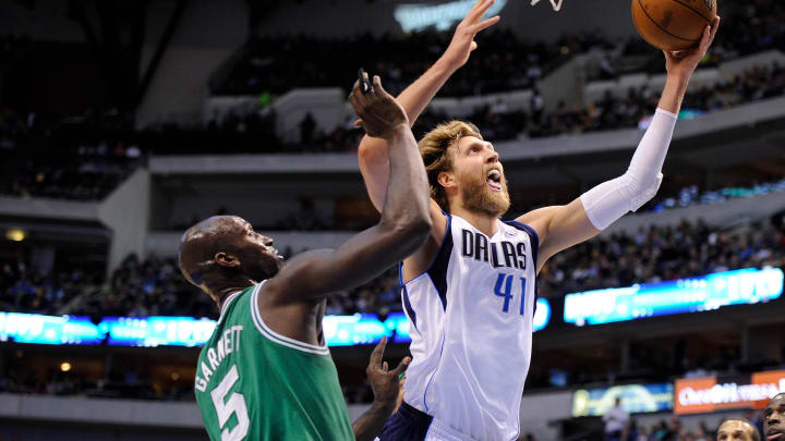 Mar 22, 2013; Dallas, TX, USA; Dallas Mavericks power forward Dirk Nowitzki (41) drives to the basket past Boston Celtics center Kevin Garnett (5) during the first quarter at the American Airlines Center. Mandatory Credit: Jerome Miron-USA TODAY Sports