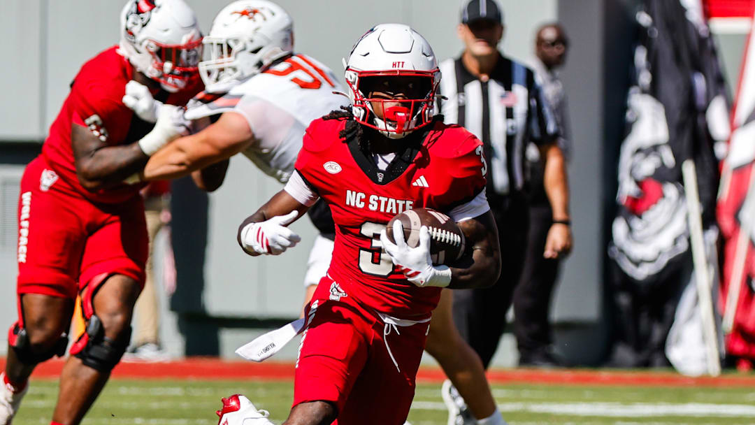 Oct 4, 2025; Raleigh, North Carolina, USA;  NC State Wolfpack running back Hollywood Smothers (3) runs with the ball during the first half of the game against Campbell Fighting Camels at Carter-Finley Stadium. Mandatory Credit: Jaylynn Nash-Imagn Images