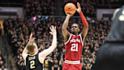 Indiana Hoosiers forward Mackenzie Mgbako (21) makes a three-point basket over Purdue Boilermakers guard Fletcher Loyer (2) during the first half at Mackey Arena.