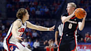 Jan 4, 2025; Oxford, Mississippi, USA; Georgia Bulldogs guard Blue Cain (0) handles the ball as Mississippi Rebels guard Eduardo Klafke (8) defends during the first half at The Sandy and John Black Pavilion at Ole Miss. Mandatory Credit: Petre Thomas-Imagn Images