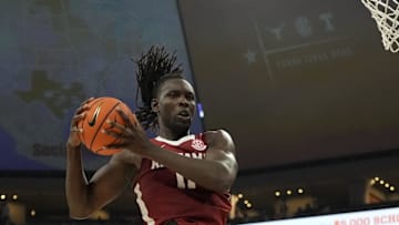 Feb 11, 2025; Austin, Texas, USA; Alabama Crimson Tide guard Clifford Omoruyi (11) grabs a rebound during the second half against the Texas Longhorns at Moody Center. Mandatory Credit: Scott Wachter-Imagn Images