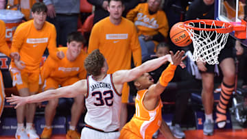 Dec 14, 2024; Champaign, Illinois, USA;  Tennessee Volunteers guard Jordan Gainey (11) drives to the basket and scores as Illinois Fighting Illini guard Kasparas Jakucionis (32) defends in the final seconds at State Farm Center. Mandatory Credit: Ron Johnson-Imagn Images