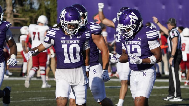 Northwestern Wildcats defensive back Evan Smith (12) after intercepting a pass against the Miami (Oh) Redhawks